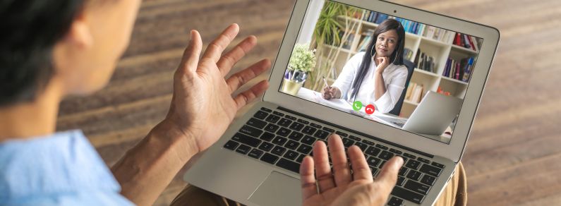 Person on video call with woman
